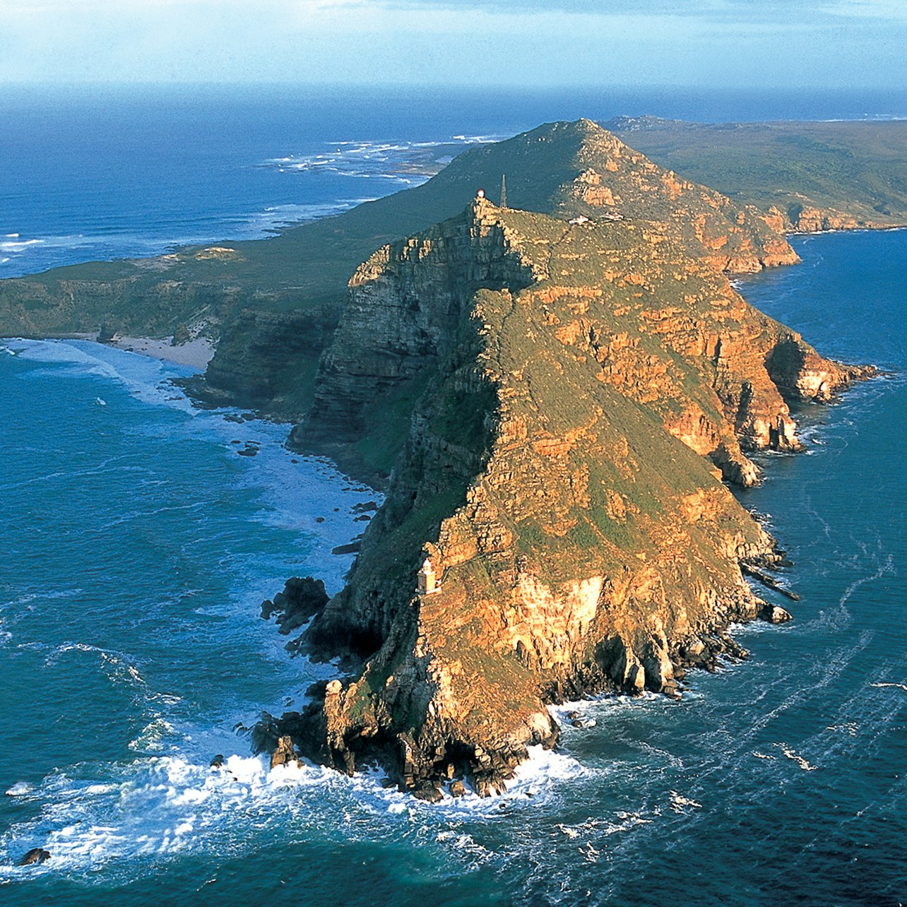 Experience the dramatic cliffs and crashing waves where the Atlantic and Indian Oceans meet offering stunning views and unique wildlife encounters along Cape Town’s iconic coastline.